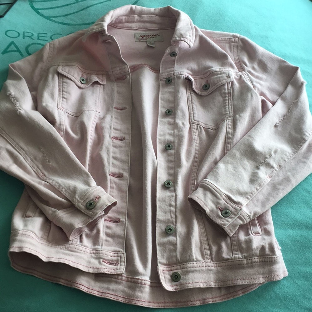 Distressed pink denim trucker jacket